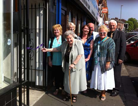 1 year ago - Mrs Adams, the first carer on the centre's database cut the ribbon to open the Derbyshire Carer's Association Centre on West Bars, watched by CEO Helen Robinson (centre) and other members at the centre. 