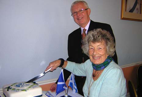 President Andrew Boswell with Past President Chrissie Yeomans (the Association's most senior Past President whose term of office was in 1955 -1956) cutting the Centenary Anniversary Cake