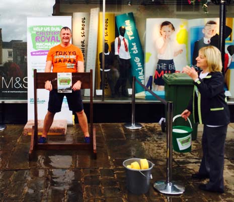 The manager of Marks and Spencer on the High Street was strapped in the stocks at lunchtime, where he had sponges thrown at him by staff and visitors to raise funds for the Macmillan Cancer Centre at Chesterfield Royal Hospital