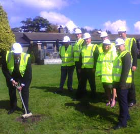 Local Councillor Graeme Baxter MBE turns the first turf...