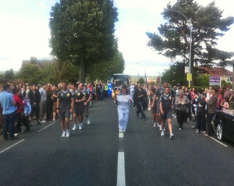 Kate Beer, our final and eldest Torch Bearer at 73, takes the Torch on it's way to Matlock