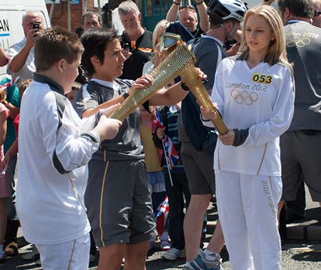 Molly Mee takes the Torch over ready to run her leg of the relay. Picture courtesy of Ian Pare