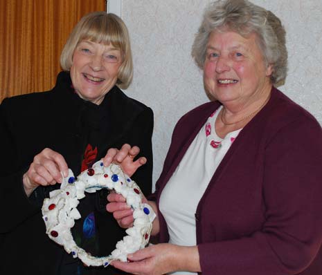 Edna (right) shows Jubilee programme co-ordinator Rosemary Early the coronet she originally wore in 1952 and will wear again at the Queen’s Diamond Jubilee celebration in Ashover in June. 