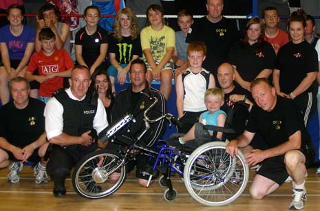 OzBox present the wheelchair to Thomas and his family