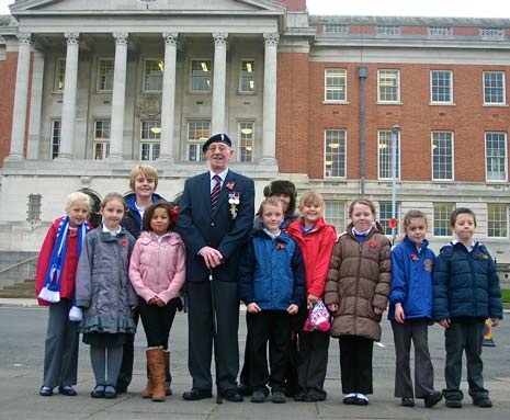 Trevor Topley with schoolchildren from New Whittington Primary School after todays tribute