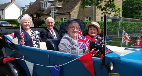 The weekend certainly proved a red letter occasion for Mrs Edna Halksworth, Ashover's 1952 Coronation Queen, who rode around the village on Monday afternoon in a vintage car driven by Rosemary Smith.
