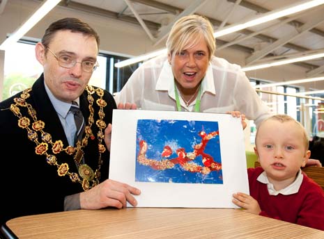 Mayor of Chesterfield, Cllr Paul Stone, Store Manager Kym Ashley and competition winner, 3 year old Marc Dawson with his Christmas Card design