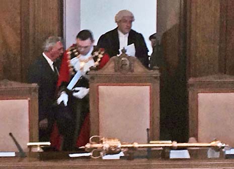 Outgoing Mayor, Cllr Paul Stone, takes his seat for the last time.