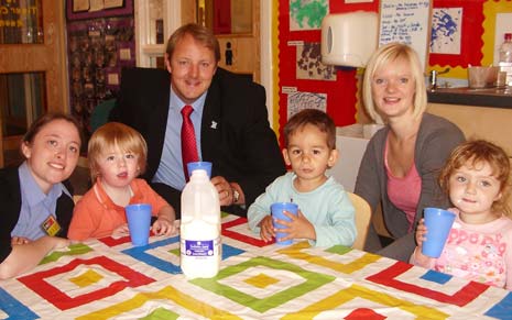 Toby Perkins MP acts as honorary milk monitor with staff and children at Families First nursery.