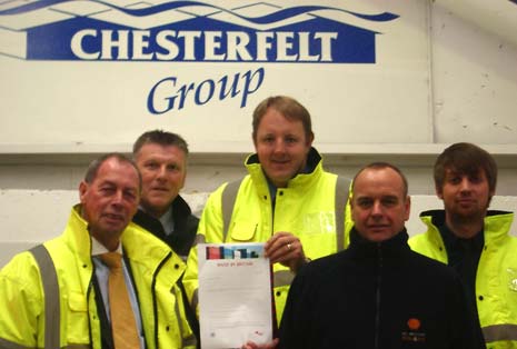 Toby Perkins MP with MD Peter Holland (front left) and other managers at Chesterfelt in the factory 'demo area'