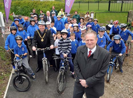 Councillor Gerorge Wharmby, Chairman of Derbyshire County Council (centre) with Councillor Simon Spencer, cabinet member for Highways and transport, with pupils from Eckington junior and secondary schools.