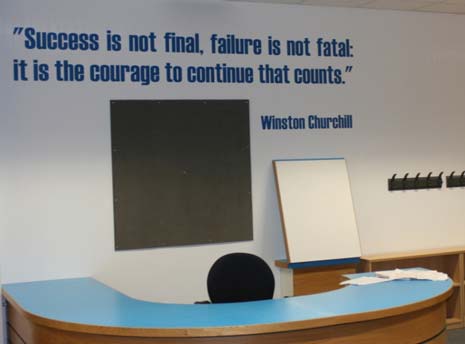 A quote from Winston Churchill adorns the wall in the new school library