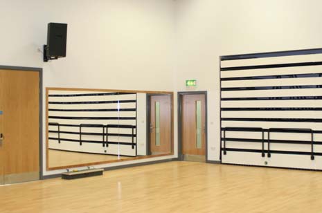 The dance studio  complete with mirrors, a sprung wooden floor and LED lighting, as well as retractable seating, which can be pulled out to turn the room into a cinema - complete with 3D projection facilities - or a theatre space.