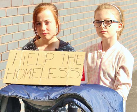 Abbie Topham and Sophie Ingham have persuaded around 80 staff and pupils at Shirebrook Academy to swap their warm beds for cardboard and sleeping bags for the night after organising the event on July 5th.