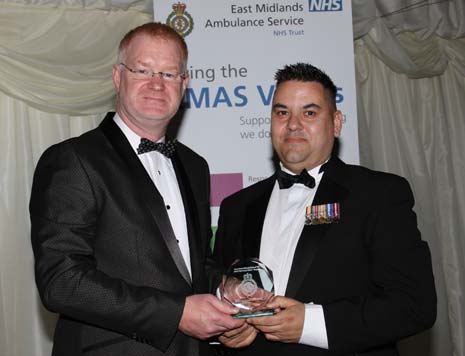 EMAS' Chief Executoive Phil Milligan (left) presents an Award to Chesterfield Emergency Care Practitioner Tim Evans