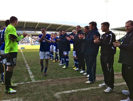 Jack Lester gets a rousing reception from the crowd and a 'guard of honour' from his teammates and coaches