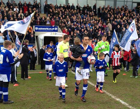 Lester leads the Spireites out as Captain for the last time