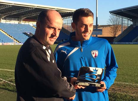 Ollie Banks receives his award from Chesterfield FC boss Paul Cook