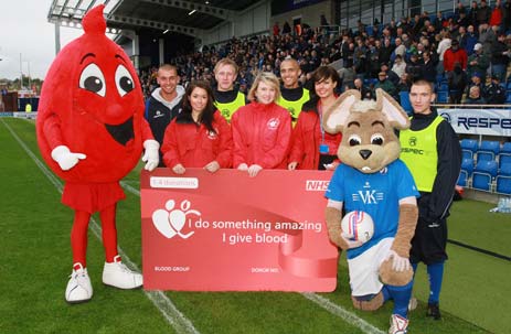 Macots, Players and NHS representatives on the pitch before the Chesterfield v Shrewsbury game on Saturday 23rd October