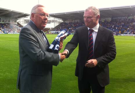 Football LEague chairman Greg Clarke presents the Champions Flag to Chesterfield FC chairman Barrie Hubbard