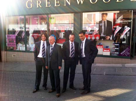The Spireites' 'Wembley Look' is modeled (best 'cataloguing' poses please) outside Greenwoods by (l-r) Goalkeeper Tommy Lee, Assistant Manager Tommy Wright, and players Mark Allott and Jack Lester.