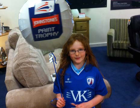 Jana is 7, and she was proudly wearing her Spireites shirt as she held the cup.