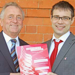 Don Amott,  Chairman of Derbyshire County Cricket Club receives Membership Certificate from Dom Stevens,  Destination Chesterfield Manager.