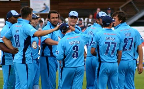 Wes Durston is congratulated by his team mates after his first ball c&b of Gareth Andrew