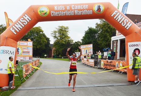 Men's Full Marathon Winner Gareth Lowe crosses the finish line