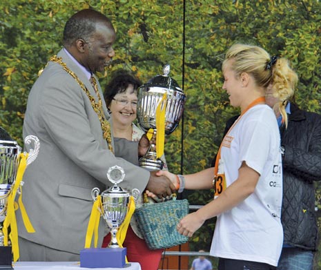 Mayor of Chesterfield Cllr Alexis Diouf presents the winning Half Marathon Trophy to Ladies winner Nicola Gleadall, who finished in 1:25:21
