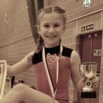 Grace Vaults Into Gold Medal Position