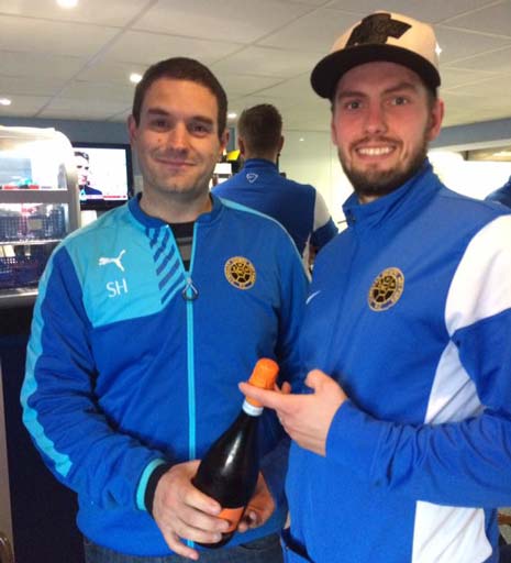 Steven Hall (left) presents Adam Lee with the Man of the Match Champagne