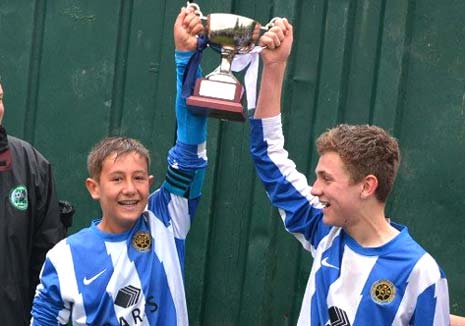 Captain Louis Rouse and Man of the Match Jordan Wells lift the Cup